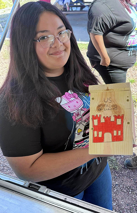 One of the volunteers shows her the nest box she built for the Juniper Titmouse, Sept. 28, 2024. One of the volunteers shows her the nest box she built for the Juniper Titmouse, Sept. 28, 2024.